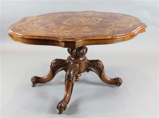 A Victorian marquetry inlaid figured walnut serpentine breakfast table, 4ft 10in. x 3ft 8in.
